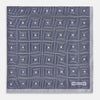 View 3 of product A folded, square Turnbull & Asser UK Geometric Grey Pocket Square in Silk featuring a geometric black and white concentric squares pattern accented with subtle navy lines, finished with a small Turnbull & Asser label in one corner.