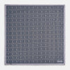 View 4 of product A folded, square Turnbull & Asser UK Geometric Grey Pocket Square in Silk featuring a geometric black and white concentric squares pattern accented with subtle navy lines, finished with a small Turnbull & Asser label in one corner.