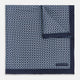 Introducing the Geometric Navy Pocket Square in Silk by Turnbull & Asser UK. This sophisticated accessory showcases a small, repeating geometric pattern in light blue and white on a rich navy background. The pocket square features a solid navy border, while the folded corner reveals the underside adorned with the Turnbull & Asser logo—an elegant finishing touch for any formal ensemble.