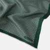 View 2 of product Turnbull & Asser UK Geometric Green Forest Green Pocket Square in Silk featuring a white geometric motif and a solid green border.