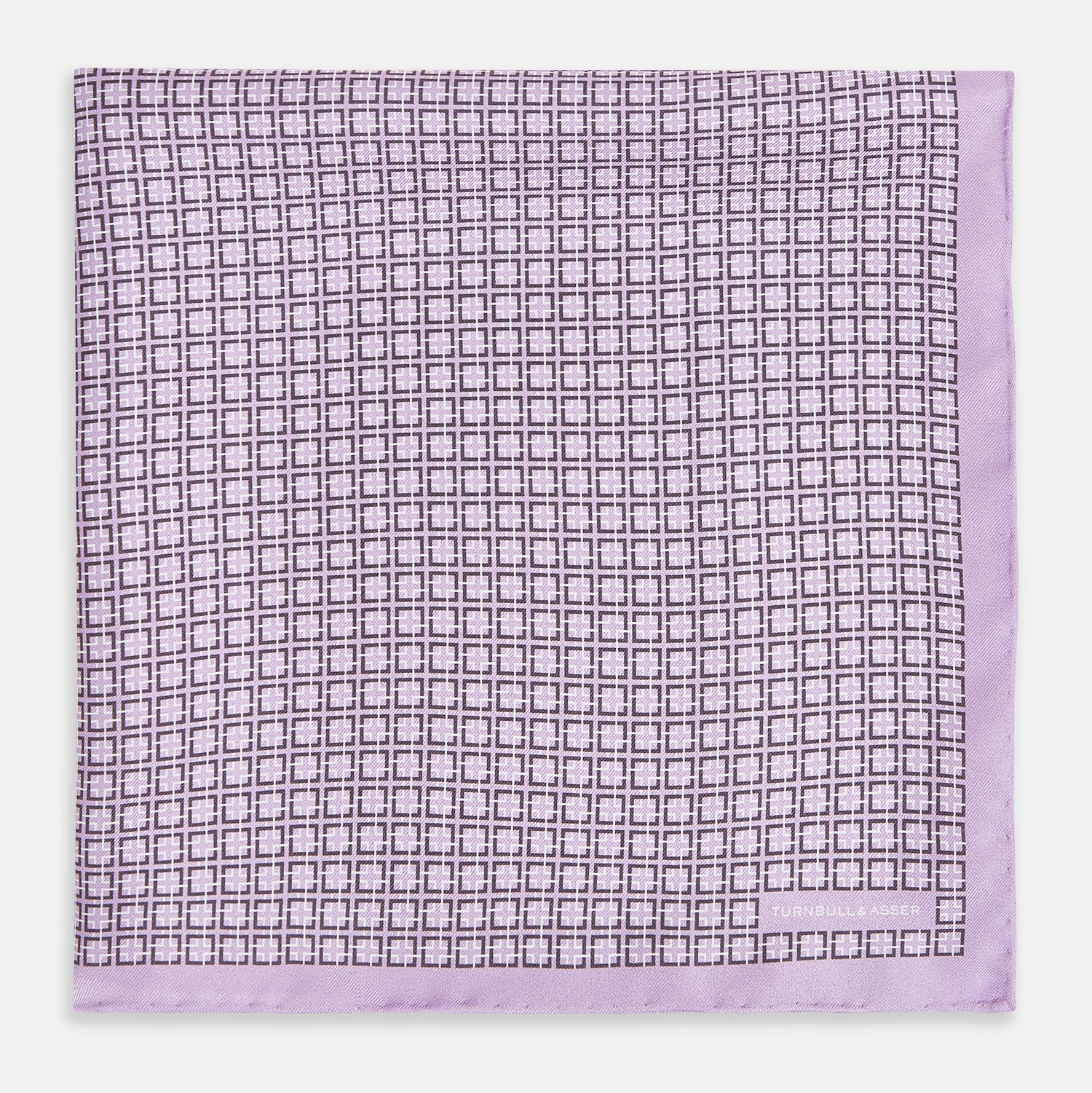 View 3 of product Crafted by Turnbull & Asser UK, the Geometric Lilac Pocket Square in Silk features an elegant square pattern in lilac hues, accented by a solid lavender border. When folded, it tastefully displays a glimpse of the sophisticated patterned underside.