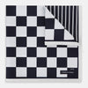 View 1 of product A square silk pocket square featuring a navy-on-white chequered pattern, labeled Turnbull & Asser UK with 2 of 20 in the bottom right corner—part of the limited edition Chequered Navy on White Frame Pocket Square from the Driver’s Capsule Collection.