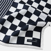 View 2 of product A square silk pocket square featuring a navy-on-white chequered pattern, labeled Turnbull & Asser UK with 2 of 20 in the bottom right corner—part of the limited edition Chequered Navy on White Frame Pocket Square from the Driver’s Capsule Collection.