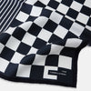 View 2 of product A chequered navy on navy frame silk pocket square from Turnbull & Asser UK, this piece is a limited edition from the Driver’s Capsule Collection, featuring “Turnbull & Asser” and “2 of 20” printed in one corner.