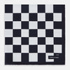 View 1 of product A chequered navy on navy frame silk pocket square from Turnbull & Asser UK, this piece is a limited edition from the Driver’s Capsule Collection, featuring “Turnbull & Asser” and “2 of 20” printed in one corner.