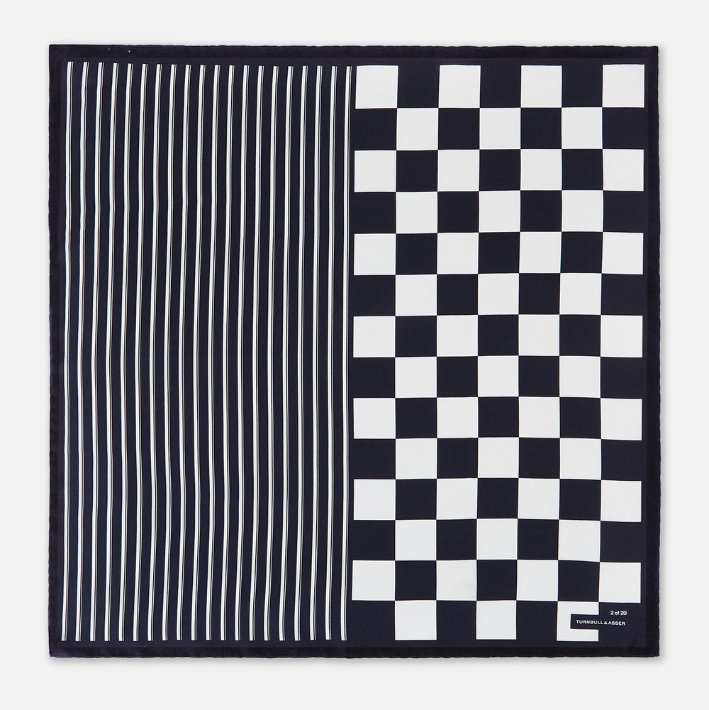 A chequered navy on navy frame silk pocket square from Turnbull & Asser UK, this piece is a limited edition from the Driver’s Capsule Collection, featuring “Turnbull & Asser” and “2 of 20” printed in one corner.