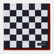 Introducing the Chequered Navy on Red Frame Pocket Square in Silk from Turnbull & Asser UK. This limited edition accessory, part of the Driver’s Capsule Collection, features a bold navy and white checkerboard pattern bordered by deep red silk. The bottom right corner is subtly detailed with white text reading “Turnbull & Asser” and “2 of 20.”.