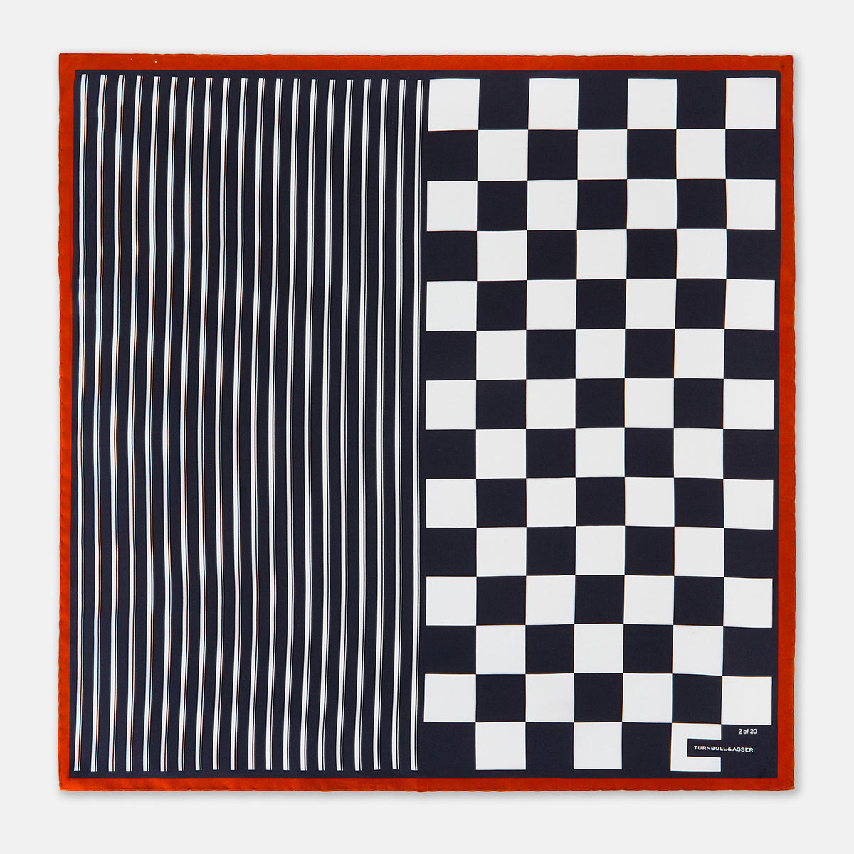 View 4 of product A limited edition silk pocket square from Turnbull & Asser UK, featuring a striking navy chequered pattern framed by a bold red border and finished with the text TURNBULL & ASSER in one corner. Part of the exclusive Driver’s Capsule Collection.