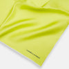 View 2 of product The Canary Yellow Piped Silk Pocket Square by Turnbull & Asser features white edges and black branding in the bottom right corner, making it a perfect accessory for formal attire. Shown on a plain white background.