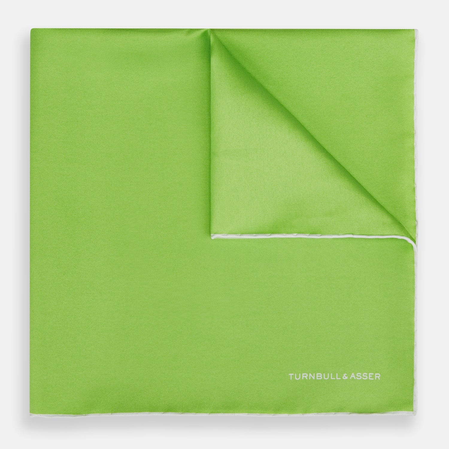 View 1 of product The Lime Green and Ecru Piped Silk Pocket Square by Turnbull & Asser adds a refined touch to any formal look.
