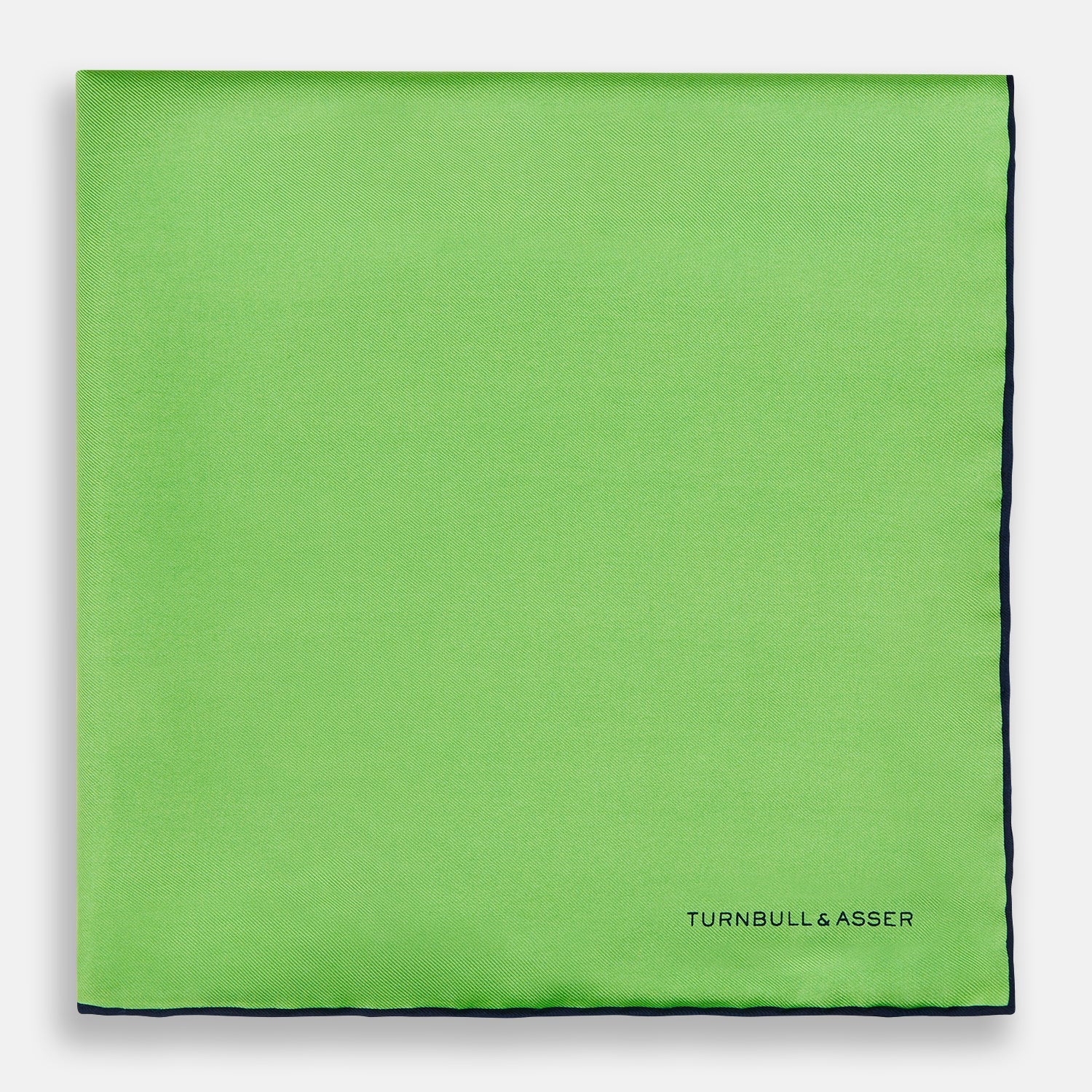 View 3 of product A neatly folded Turnbull & Asser LIGHT GREEN AND BLACK PIPED SILK POCKET SQUARE—ideal for elevating formal attire.