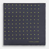 View 3 of product A grey and lime spot silk pocket square by Turnbull & Asser, featuring evenly spaced dots and the brand's logo in one corner—perfect for adding a stylish touch to formal attire.