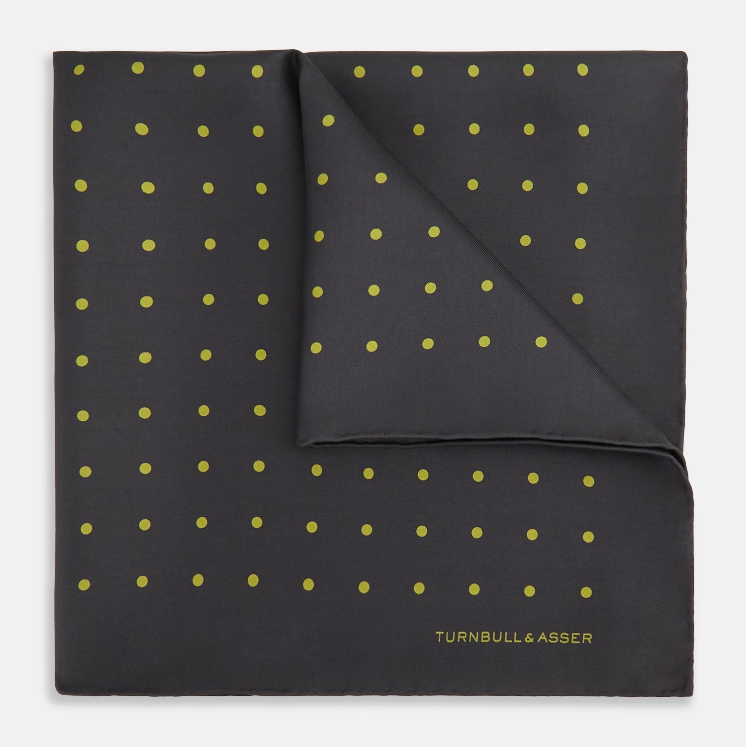 View 1 of product A grey and lime spot silk pocket square by Turnbull & Asser, featuring evenly spaced dots and the brand's logo in one corner—perfect for adding a stylish touch to formal attire.