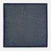 View 4 of product The Rosette Navy Pocket Square in Silk by Turnbull & Asser UK is a square, navy blue accessory featuring a small geometric pattern. Shown laid flat with one corner folded, it reveals a contrasting, finer motif on the reverse side. This elegant double-sided design offers versatile styling options for any occasion.