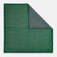 The Rosette Green Pocket Square in Silk by Turnbull & Asser UK features a small geometric medallion pattern and is shown folded to display a contrasting fine black-and-white design on the reverse side.