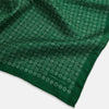 View 3 of product The Rosette Green Pocket Square in Silk by Turnbull & Asser UK features a small geometric medallion pattern and is shown folded to display a contrasting fine black-and-white design on the reverse side.