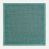 View 5 of product A square silk pocket square in Rosette Green by Turnbull & Asser UK, featuring a teal base with a grid of dark dots. One corner is folded to showcase the black and white microdot pattern on the reverse, while subtle hints of navy, aqua, and green form geometric medallions that lend a refined modern touch.
