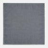 View 6 of product A square silk pocket square in Rosette Green by Turnbull & Asser UK, featuring a teal base with a grid of dark dots. One corner is folded to showcase the black and white microdot pattern on the reverse, while subtle hints of navy, aqua, and green form geometric medallions that lend a refined modern touch.