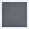 View 6 of product The Checked Blue Pocket Square in Silk by Turnbull & Asser UK features a navy base with a light blue grid pattern on one side and a refined dotted design on the other. This double-sided accessory is shown partially folded to elegantly showcase both distinctive patterns.