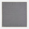 View 5 of product A yellow silk pocket square featuring a small black grid pattern of dotted squares, neatly folded at one corner. "Turnbull & Asser UK" is printed in the bottom right corner.