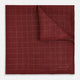 The Turnbull & Asser UK Checked Burgundy Pocket Square in Silk features a sophisticated burgundy hue with a subtle grid pattern. It's displayed folded at one corner to reveal a contrasting small checkered design on the reverse, showcasing its refined double-sided craftsmanship.