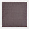 View 7 of product The Turnbull & Asser UK Checked Burgundy Pocket Square in Silk features a sophisticated burgundy hue with a subtle grid pattern. It's displayed folded at one corner to reveal a contrasting small checkered design on the reverse, showcasing its refined double-sided craftsmanship.