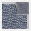 View 4 of product A square silk pocket square from Turnbull & Asser UK, featuring a subtle floral grey pattern; one corner is folded to reveal its double-sided design with a complementary pattern on the reverse side.