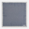 View 5 of product A square silk pocket square from Turnbull & Asser UK, featuring a subtle floral grey pattern; one corner is folded to reveal its double-sided design with a complementary pattern on the reverse side.