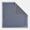 View 1 of product The Turnbull & Asser UK Floral Blue Pocket Square in Silk showcases a refined double-sided design, with a clustered dot pattern in blue and white on the front and a delicate fine dotted motif on the back. Presented with one corner elegantly folded, it exudes sophisticated style.