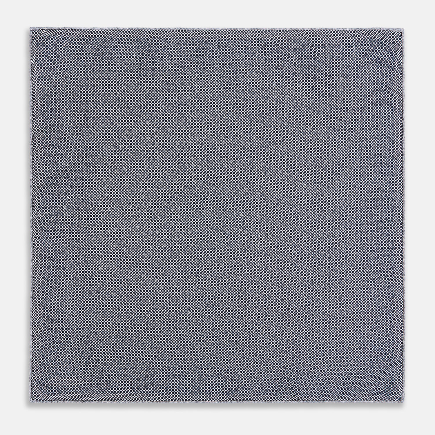 View 6 of product The Turnbull & Asser UK Floral Blue Pocket Square in Silk showcases a refined double-sided design, with a clustered dot pattern in blue and white on the front and a delicate fine dotted motif on the back. Presented with one corner elegantly folded, it exudes sophisticated style.
