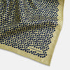 View 3 of product Introducing the Floral Yellow Pocket Square in Silk by Turnbull & Asser UK—a sophisticated square accessory featuring a vibrant yellow border and a black-and-white geometric dot pattern. One corner is tastefully folded to reveal its double-sided design, showcasing a smaller, denser dot motif on the reverse. Perfect for adding a modern touch of flair to any outfit or setting.