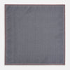 View 6 of product The Floral Pink Pocket Square in Silk by Turnbull & Asser UK showcases a refined pattern with a pink floral design and a contrasting border. The top right corner is elegantly folded to reveal the reverse side’s complementary blue and white dotted motif, emphasizing its double-sided versatility.