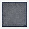 View 5 of product Introducing the Geometric Navy Tile Pocket Square in Silk by Turnbull & Asser UK—a folded navy and white accessory showcasing a double-sided design, with one side featuring concentric squares that form a striking geometric pattern and the other adorned with an elegant small dot motif.