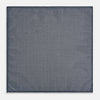 View 6 of product Introducing the Geometric Navy Tile Pocket Square in Silk by Turnbull & Asser UK—a folded navy and white accessory showcasing a double-sided design, with one side featuring concentric squares that form a striking geometric pattern and the other adorned with an elegant small dot motif.
