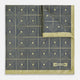 The Turnbull & Asser UK Geometric Yellow Tile Pocket Square in Silk features a sophisticated geometric square pattern in gold and navy, accented with subtle concentric squares and a discreet label stitched into the bottom right corner. Its double-sided design is highlighted by a folded corner that reveals a contrasting dotted navy and white underside.