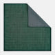 The Geometric Green Tile Pocket Square in Silk by Turnbull & Asser UK features a sophisticated tonal green design with a subtle pattern of concentric squares. One corner is folded to highlight the elegant double-sided construction, revealing a contrasting black and white small dot pattern on the reverse.