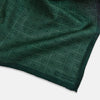 View 3 of product The Geometric Green Tile Pocket Square in Silk by Turnbull & Asser UK features a sophisticated tonal green design with a subtle pattern of concentric squares. One corner is folded to highlight the elegant double-sided construction, revealing a contrasting black and white small dot pattern on the reverse.