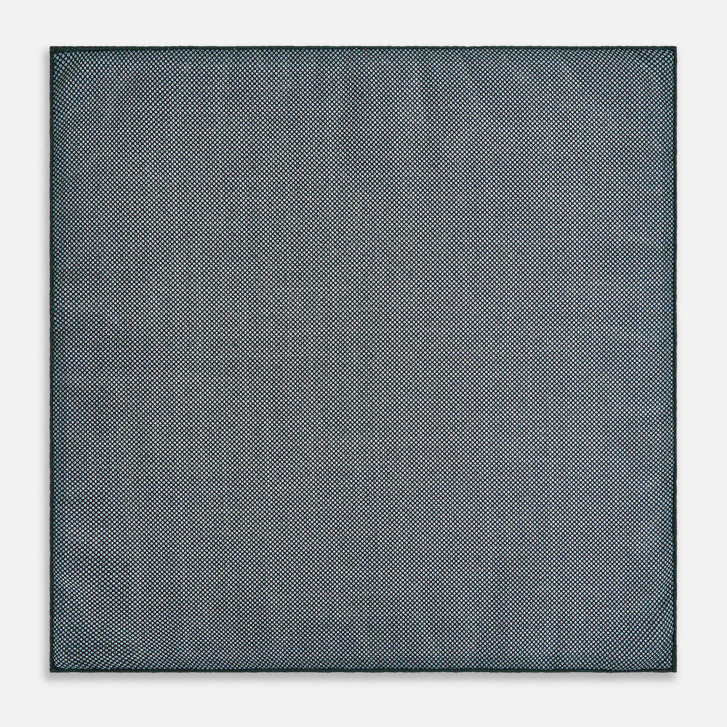 View 6 of product The Geometric Green Tile Pocket Square in Silk by Turnbull & Asser UK features a sophisticated tonal green design with a subtle pattern of concentric squares. One corner is folded to highlight the elegant double-sided construction, revealing a contrasting black and white small dot pattern on the reverse.