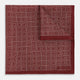 The Turnbull & Asser UK Geometric Burgundy Tile Pocket Square in Silk is displayed partly folded, showcasing its bold geometric grid pattern with concentric burgundy squares on the front and a contrasting black-and-white dotted design on the reverse.