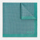 A geometric green silk pocket square by Turnbull & Asser UK, featuring a subtle houndstooth weave with a teal border, and partially folded to reveal a contrasting black and white micro-dot reverse pattern.
