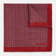 Turnbull & Asser UK’s Geometric Red Pocket Square in Silk features a small white checkered pattern and a cleverly flipped corner to showcase its contrasting black and white micro-dot reverse design.
