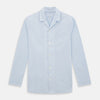 View 1 of product The Turnbull & Asser Pale Blue Fine Micro Check Pyjama Shirt features long sleeves, a notched collar, and a chest pocket—styled flat on white, ideal for elegant nightwear.