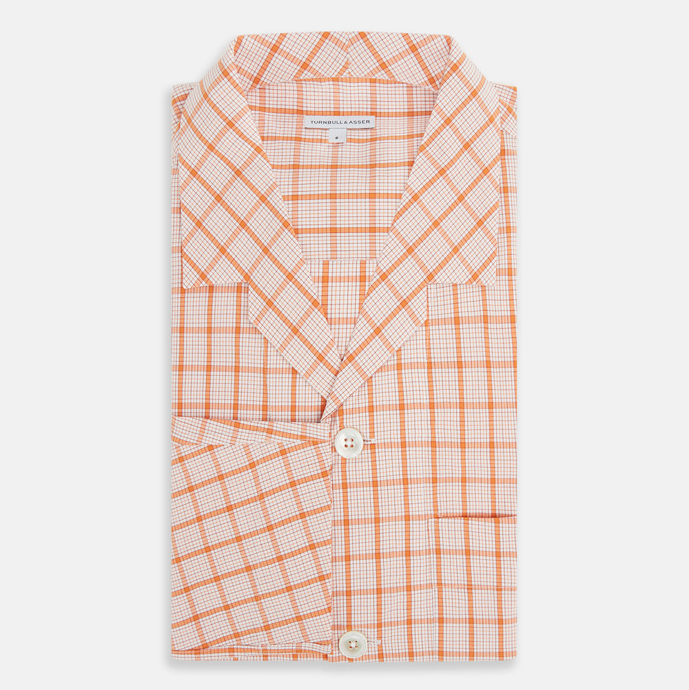 The Orange Graph Overlay Check Pyjama Shirt by Turnbull & Asser features long sleeves, a notched collar, and a front chest pocket, shown here laid flat on a white background.
