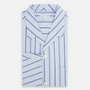 View 5 of product The Turnbull & Asser Blue Track Stripe Pyjama Shirt features a collar, white buttons, chest pocket, and vertical navy stripes—an elegant and comfortable loungewear option perfect for stylish nightwear.