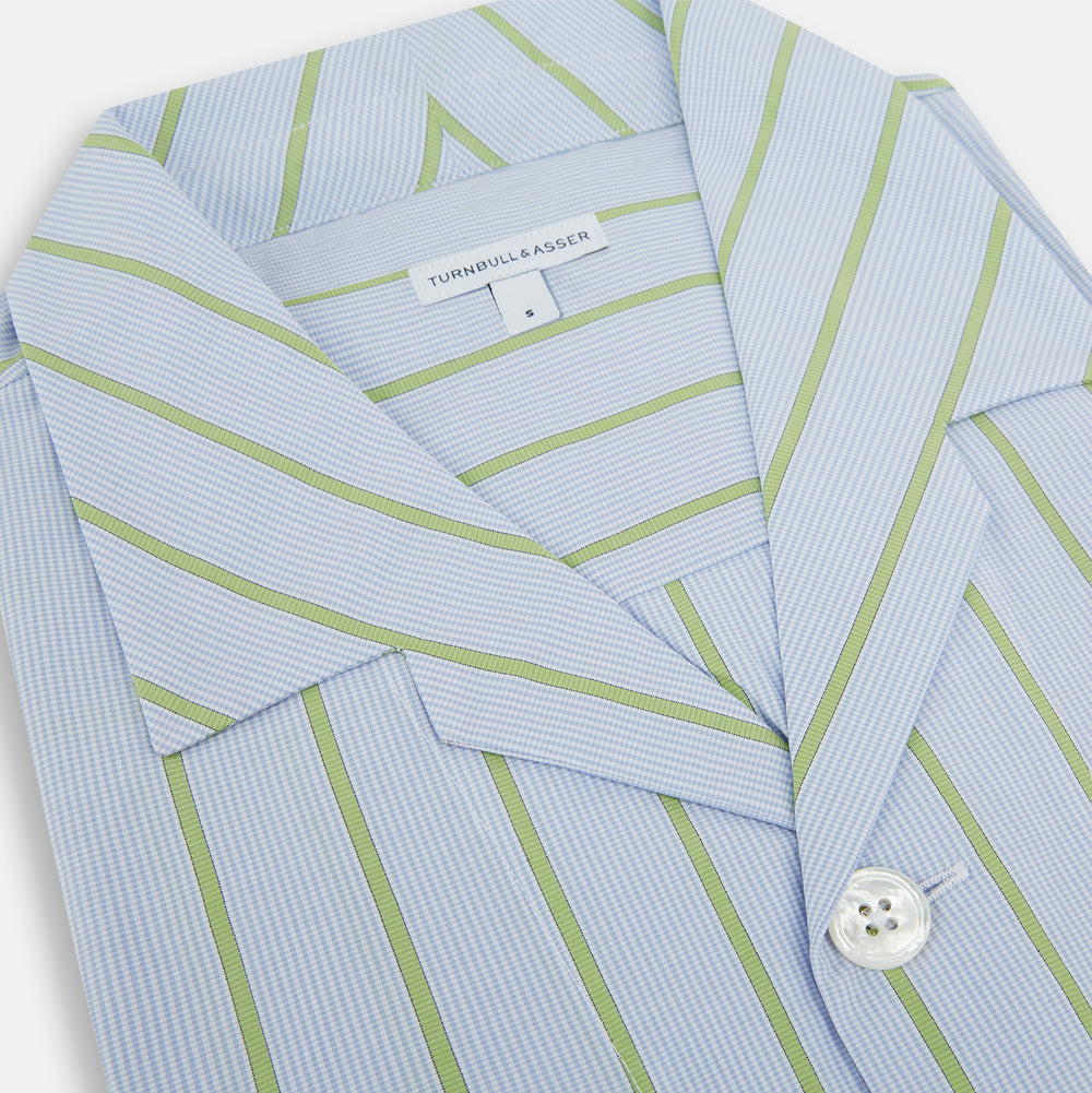 The Turnbull & Asser Light Green and Blue Stripe Pyjama Shirt features long sleeves, a front chest pocket, and elegant loungewear style, shown on a plain white background.