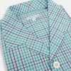 View 2 of product The Turnbull & Asser Green and Blue Shadow Check Pyjama Shirt, with a collar and chest pocket, is perfect loungewear or nightwear; shown laid flat on a white background.