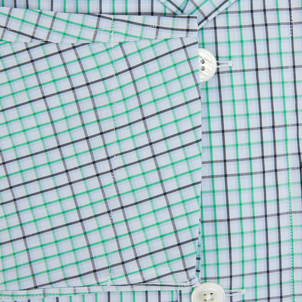 The Turnbull & Asser Green and Blue Shadow Check Pyjama Shirt, with a collar and chest pocket, is perfect loungewear or nightwear; shown laid flat on a white background.