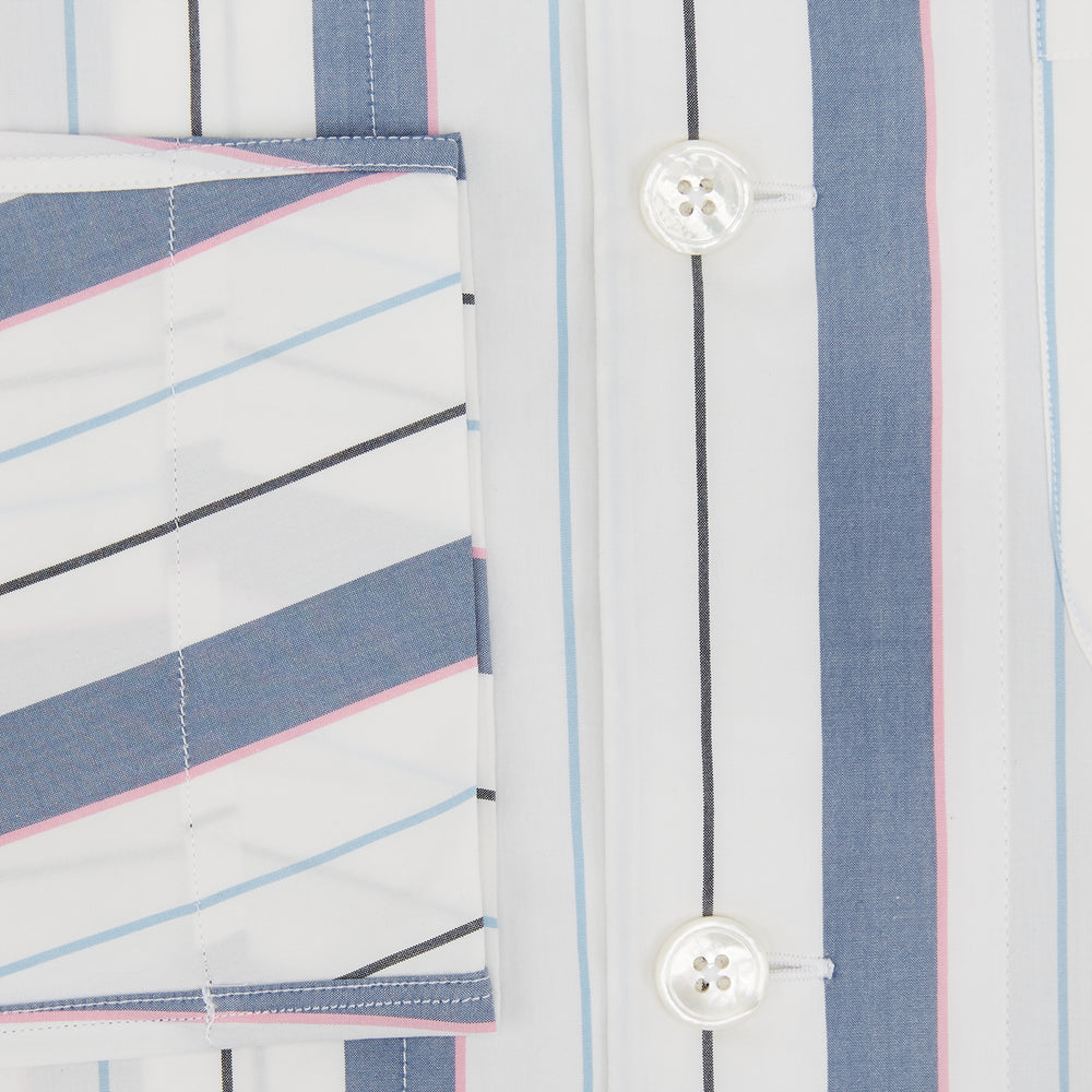 The Turnbull & Asser Blue Blazer Stripe Pyjama Shirt features a collar, chest pocket, and vertical blue, white, and light red stripes—an elegant long-sleeve loungewear piece neatly displayed on a plain white background.