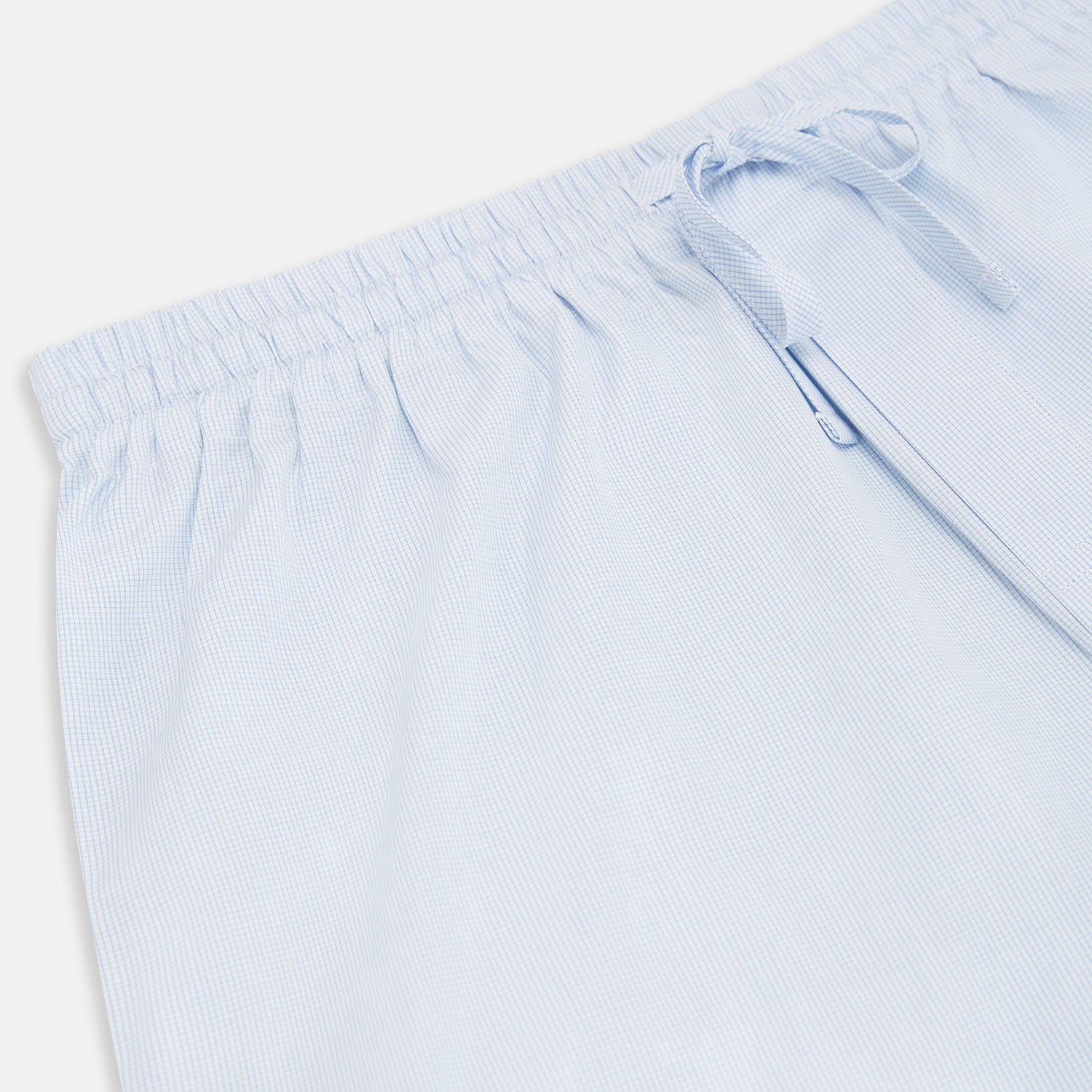 View 2 of product Turnbull & Asser’s Pale Blue Micro Check Pyjama Trousers feature an elastic waistband with drawstring for comfort, making these light blue sleepwear pants ideal for relaxing and sleeping.