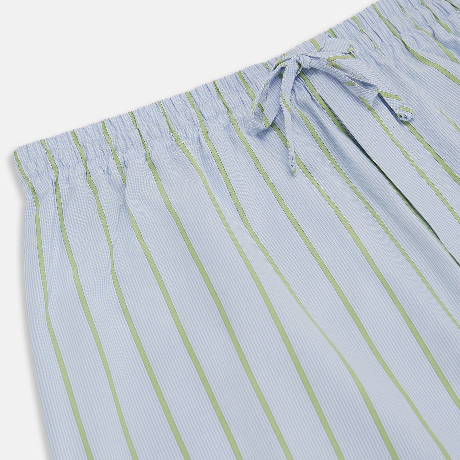 View 2 of product Turnbull & Asser Light Green and Blue Stripe Pyjama Trousers feature a loose fit and elastic drawstring waistband. Made from cotton, these loungewear trousers are shown flat on a white background, ideal for comfort and style.